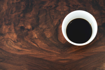 Cup coffee on texture wooden working space. copy space