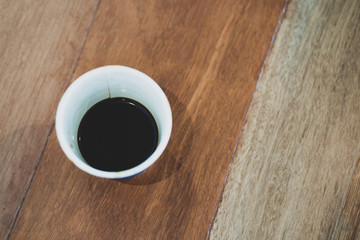 Cup coffee on texture wooden working space. copy space