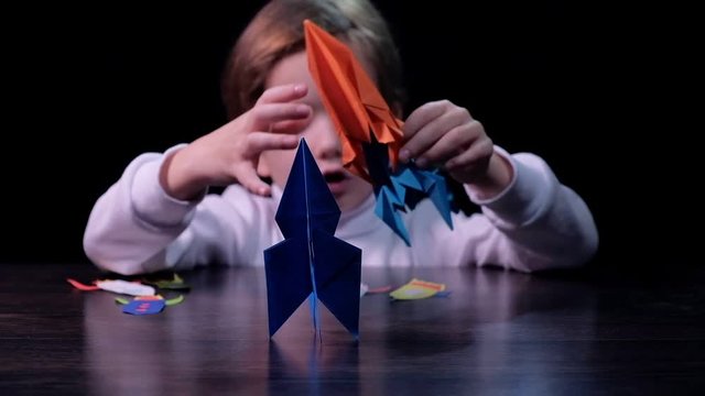 Boy play with toy rocket, child spaceship astronomy, pretend childhood.