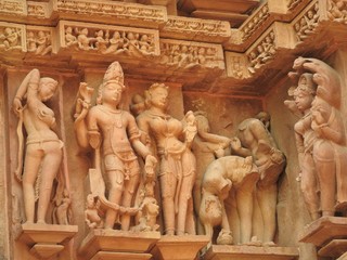 Erotic sculptures and sex poses of man in kajuraho temples, Madhya Pradesh, India. Built around...