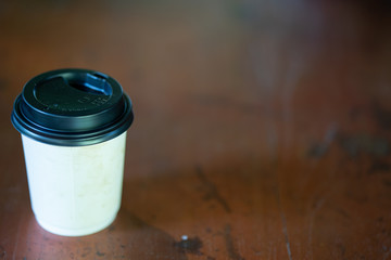 Cup coffee on wooden table.