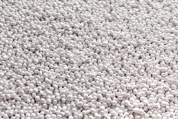 White polymer dye in granules, background texture