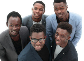 top view .smiling young business people looking at the camera