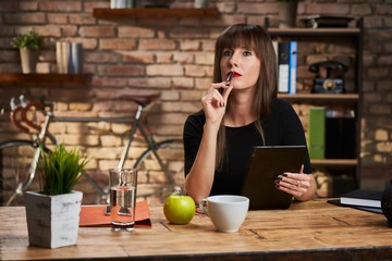 Woman reading tablet