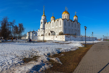 Fototapeta na wymiar The panorama is with the Holy Dormition Cathedral. There is a Sunny day in early spring. Vladimir, Russia.