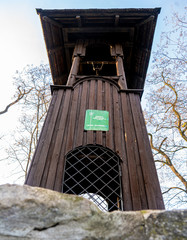 Old wooden belfry of the miners from the silver mine at the church of Piotr and Paweł in Tarowskie Góry - obrazy, fototapety, plakaty