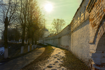 View of the street located near the walls of the ancient Kremlin. There is a Sunny day in early spring. Vladimir, Russia.
