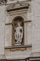 Fototapeta na wymiar Architectural fragments of Polish Baroque church of Saints Peter and Paul facade (1619) in Krakow Old Town. Krakow, Poland.