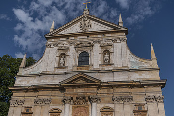 Fototapeta premium Architectural fragments of Polish Baroque church of Saints Peter and Paul facade (1619) in Krakow Old Town. Krakow, Poland.