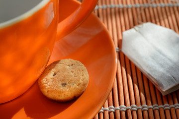Small cookie on saucer Tea bag