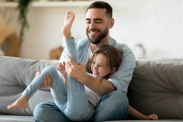 Father spend time enjoy playtime on weekend with little daughter