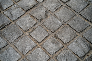 Paving road lined with gray stones