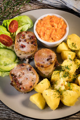 Pork tenderloin wrapped in bacon.