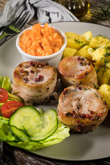 Pork tenderloin wrapped in bacon.