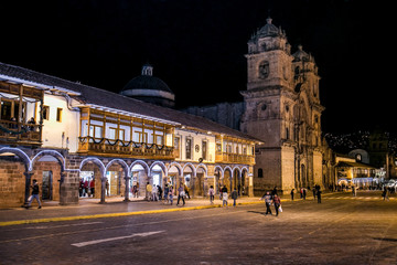 Fototapeta na wymiar Historic Colonial Buildings on the Plaza de Armas Square with Many Visitor at Night, Cusco, Peru, South America,