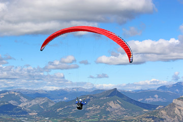 Paraglider flying in the French Alps