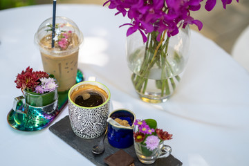 Coffee set on white table.