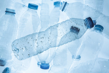 Empty plastic bottle (Polyethylene Terephthalate or PET bottle) on the plastic bottles background....