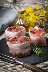 Beef tenderloin steaks wrapped in bacon.