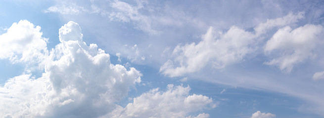 Beautiful blue clear sky with white clouds background in sunny day and copy space. Nature bright sky background image. Summer blue sky. Texture for Design. Natural cloudy Wallpaper.