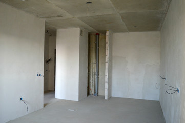 Apartment building under construction, apartment designed by the developer, plaster screed.