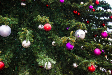 Obraz na płótnie Canvas Christmas balls on an artificial Christmas tree
