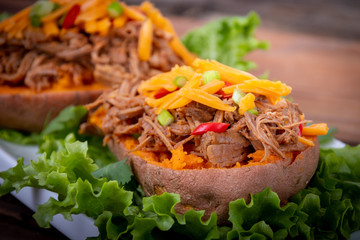 delicious spicy pulled pork stuffed sweet potato dish
