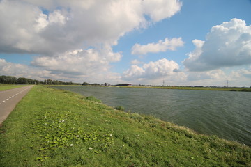Fototapeta na wymiar Rowing lane at the Water for the Eendragtspolder from river Rotte. This polder is used to store 4 million liters water to prevent flooding of Rotterdam