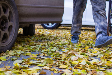 a blurry photo of an open car door at an autumn sunset