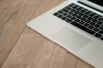 Overhead of modern comfort work place. Different objects on wooden background.