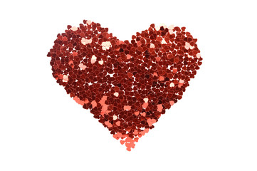Fototapeta na wymiar Red sequins heart shape symbol on white background. February 14, Valentines day luxury and glamour greeting card isolated design element. Shiny glitter love and romance creative decoration
