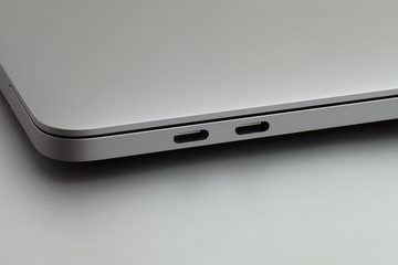 Space grey laptop with two usb Type-C