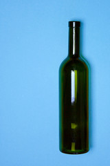 Empty Wine Bottle glasses blue background