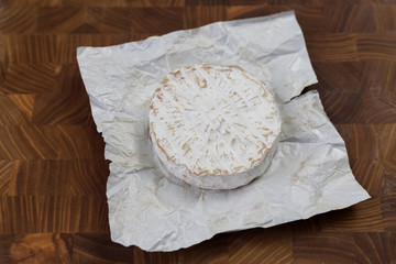  blue cheese lies on a wooden board