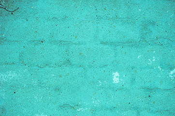 Fragment of old house wall close-up. Blue background. Peeling plaster on concrete surface. Cracks in paint. light blue tinted. Copy space. Place for text. Selective focus image. 