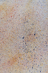 multicolored splashes of paint on a white sheet