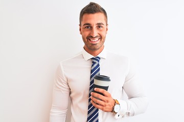 Naklejka premium Young handsome business man drinking take away coffee over isolated background with a happy face standing and smiling with a confident smile showing teeth