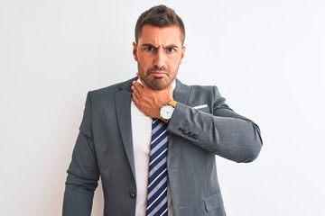 Young handsome business man wearing suit and tie over isolated background cutting throat with hand as knife, threaten aggression with furious violence