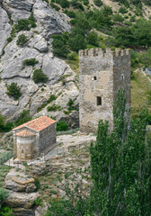 Fototapeta na wymiar Ancient tower and church near fortress in Sudak, Crimea, Russia.