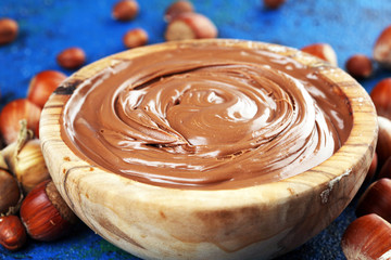 Homemade hazelnut spread in wooden bowl. Hazelnut Nougat cream with hazelnuts