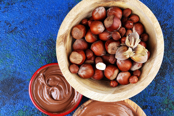 Homemade hazelnut spread in wooden bowl. Hazelnut Nougat cream with hazelnuts