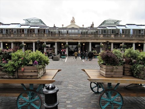 Unrecognizable Tourists And Locals Shopping And Visiting At Apple Market In Covent Garden 