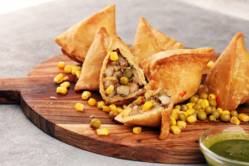 Vegetarian samsa or samosas.Indian special traditional street food fried punjabi samosa or Coxinha, Croquete and other Fried Brazilian Snacks