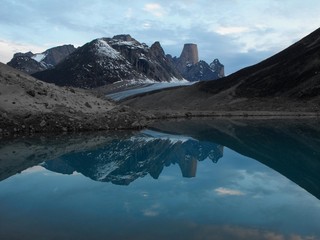 Mount Asgarg and the reflection on the water, Auyuittuq National Park Baffin Island Canada