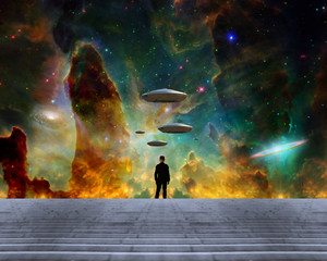 Man observes UFO fleet in vivid sky. Colorful nebula © rolffimages