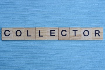  gray word collector from small wooden letters on a blue table