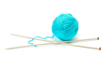 Ball of woolen thread and knitting needles isolated on white background.
