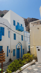 View of white-blue houses and street on greek island Nisyros, Greece 