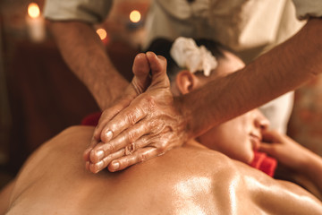 Alternative Medicine. Therapist healing woman doing ayurvedic massage with herbal oil close-up - obrazy, fototapety, plakaty