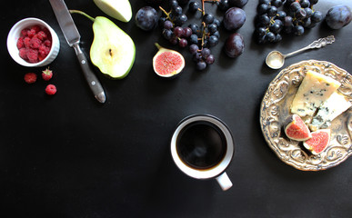 fruits, berries, cheese dor battle. On a black background. Flat lay concept.